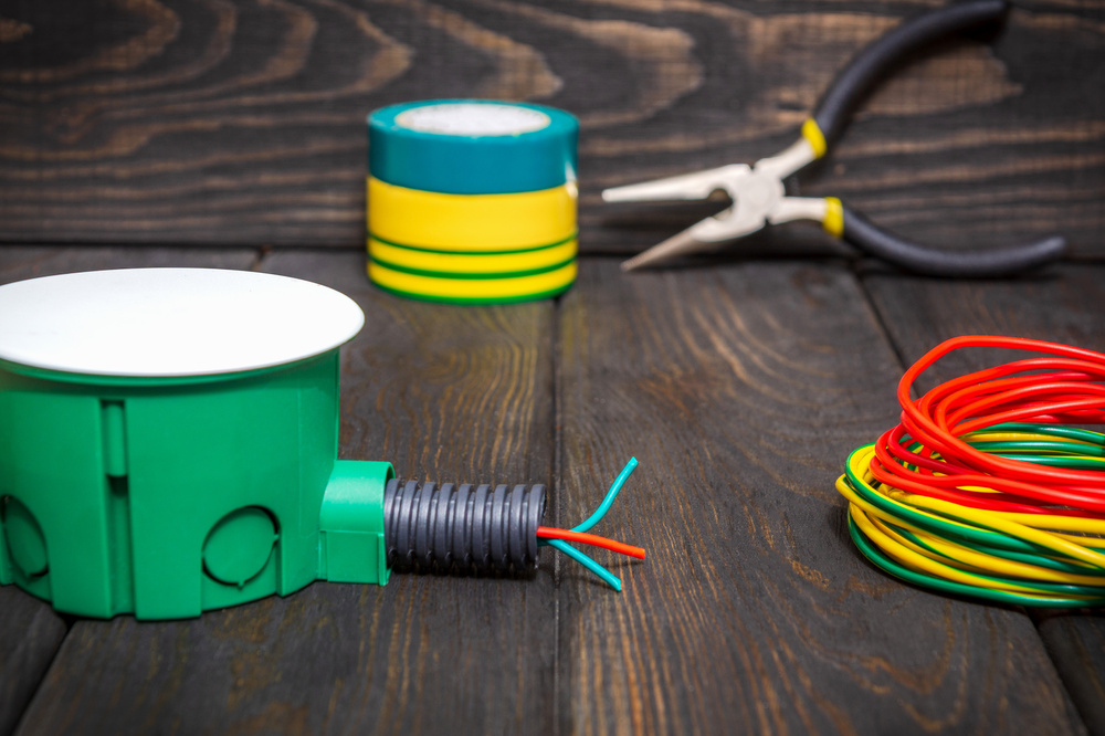 Electrical junction green box with wires used in the electric installation process